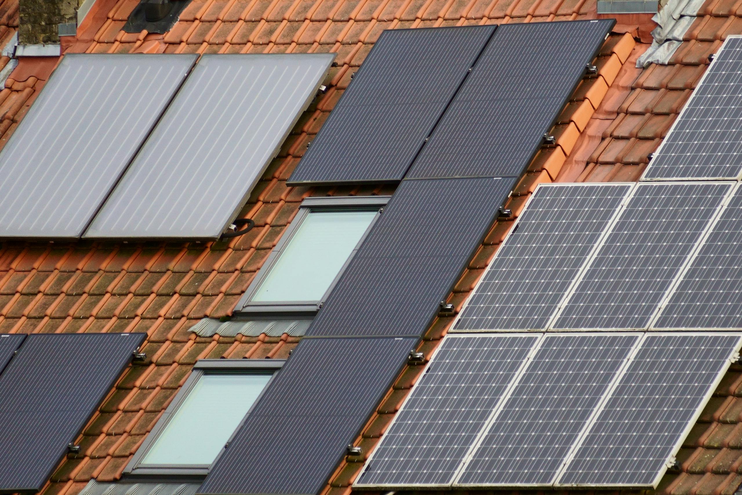 Close-up of solar panels on a tiled roof, showcasing to mount solar panels on a roof rack.