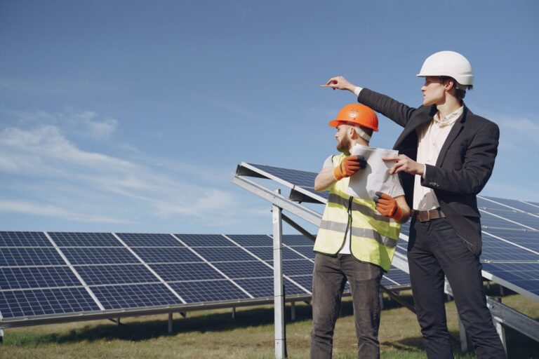 Ground-mount solar array installation with driven pile foundations and racking
